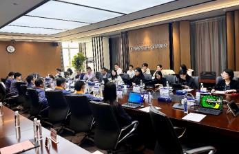 A group of people sitting at a table
AI-generated content may be incorrect.