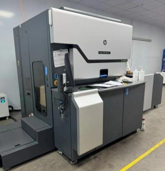 This HP Indigo digital press delivers fast, high-quality variable-data printing with short setup times, vibrant color accuracy, and zero plate changes, making it ideal for on-demand packaging and commercial print jobs.