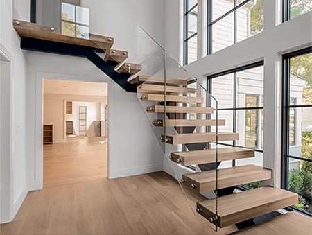 Floating solid oak stairs with glass railings