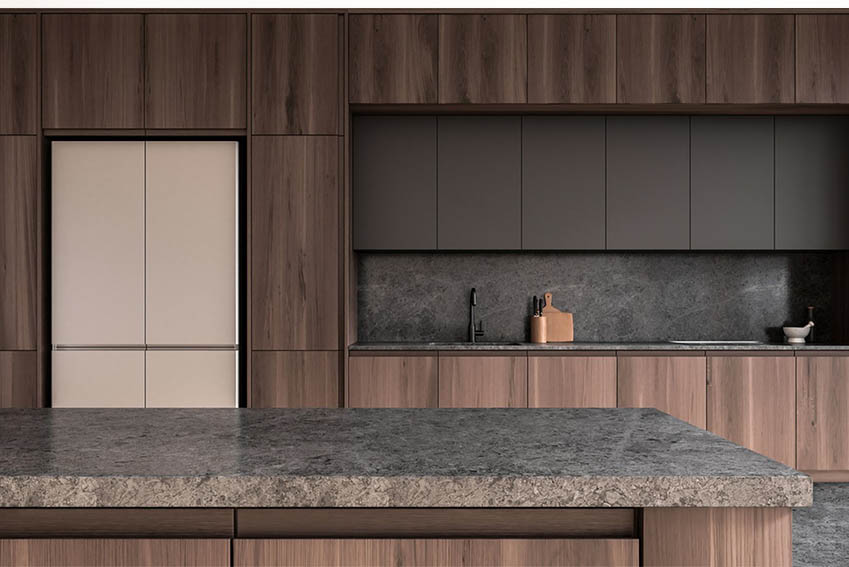 Granite island countertop with walnut veneer kitchen cabinets