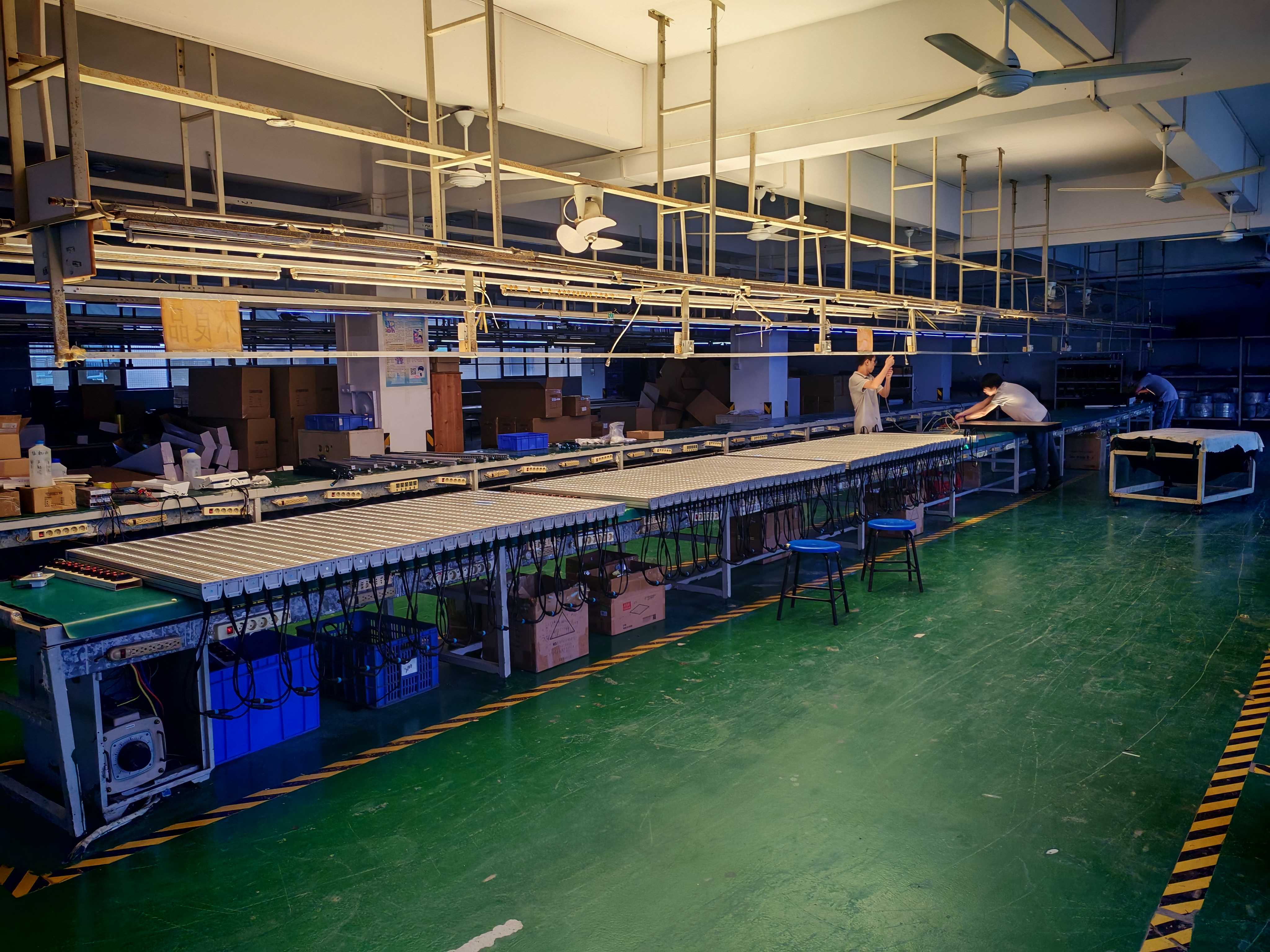 TPK Lighting packaging workshop on the third floor of the engineering building, Zhongshan, with LED wall washers under aging test on the production line