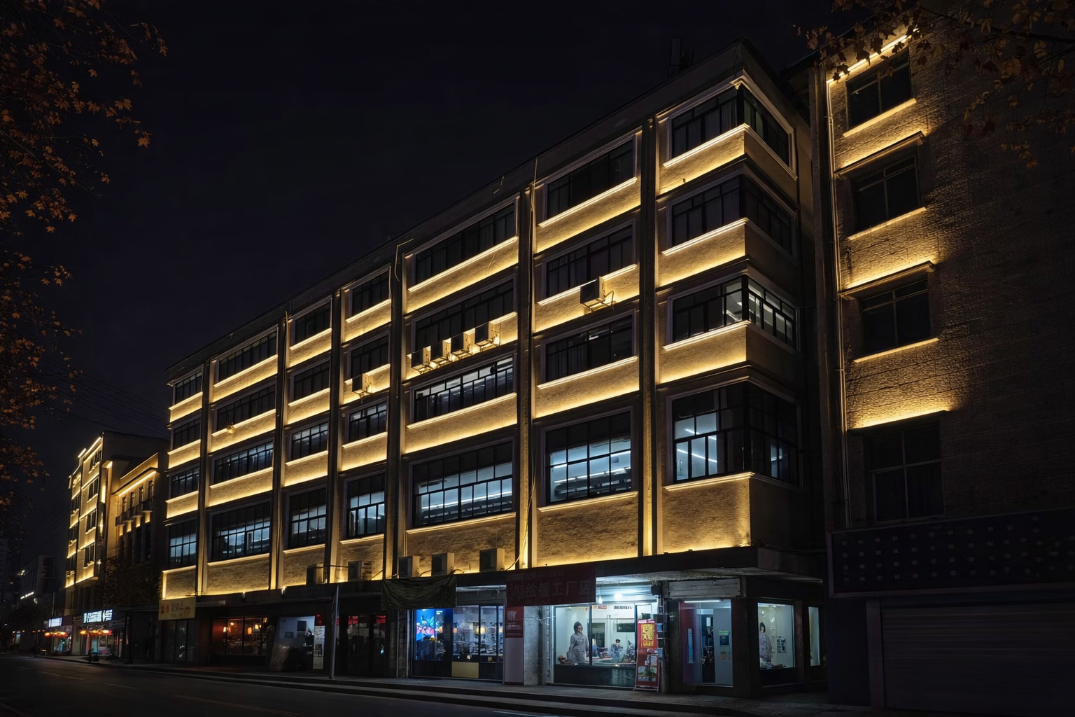 Consistent 3000K warm white facade lighting creating a cohesive nightscape