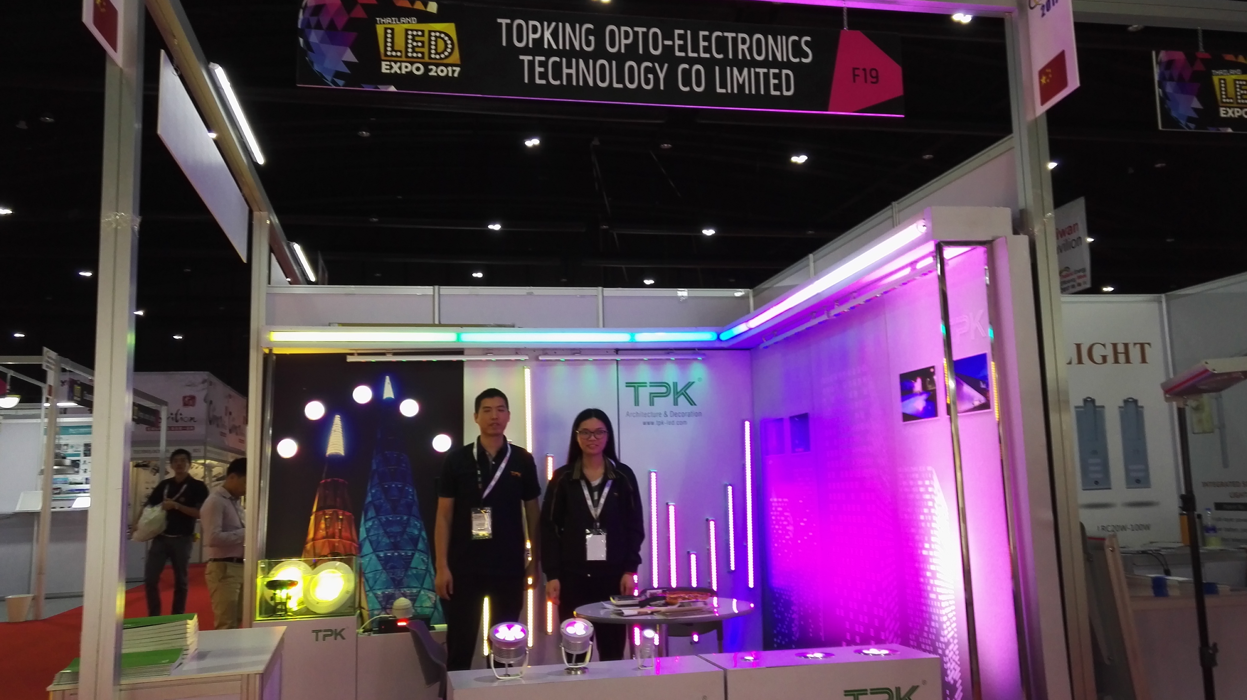 TPK Lighting sales engineers discussing architectural lighting project schematics with clients