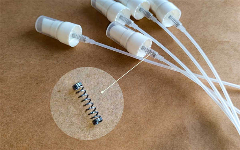 a picture of conventional mist sprayers with metal springs