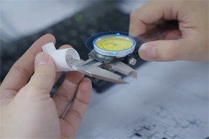 Quality control check: measuring foam pump dimensions with a caliper