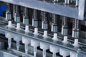 machine producing foam pumps in workshop