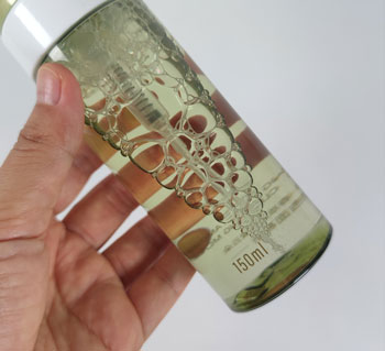 Clear green-tinted PET foam pump bottle displaying the product inside