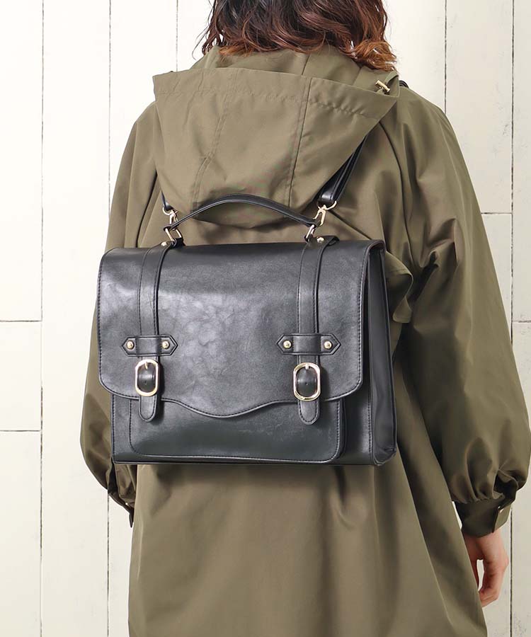 The satchel is flat from the bottom & has a long strap and a top handle.  These bags are ideal for carrying laptops, books and other necessary items.